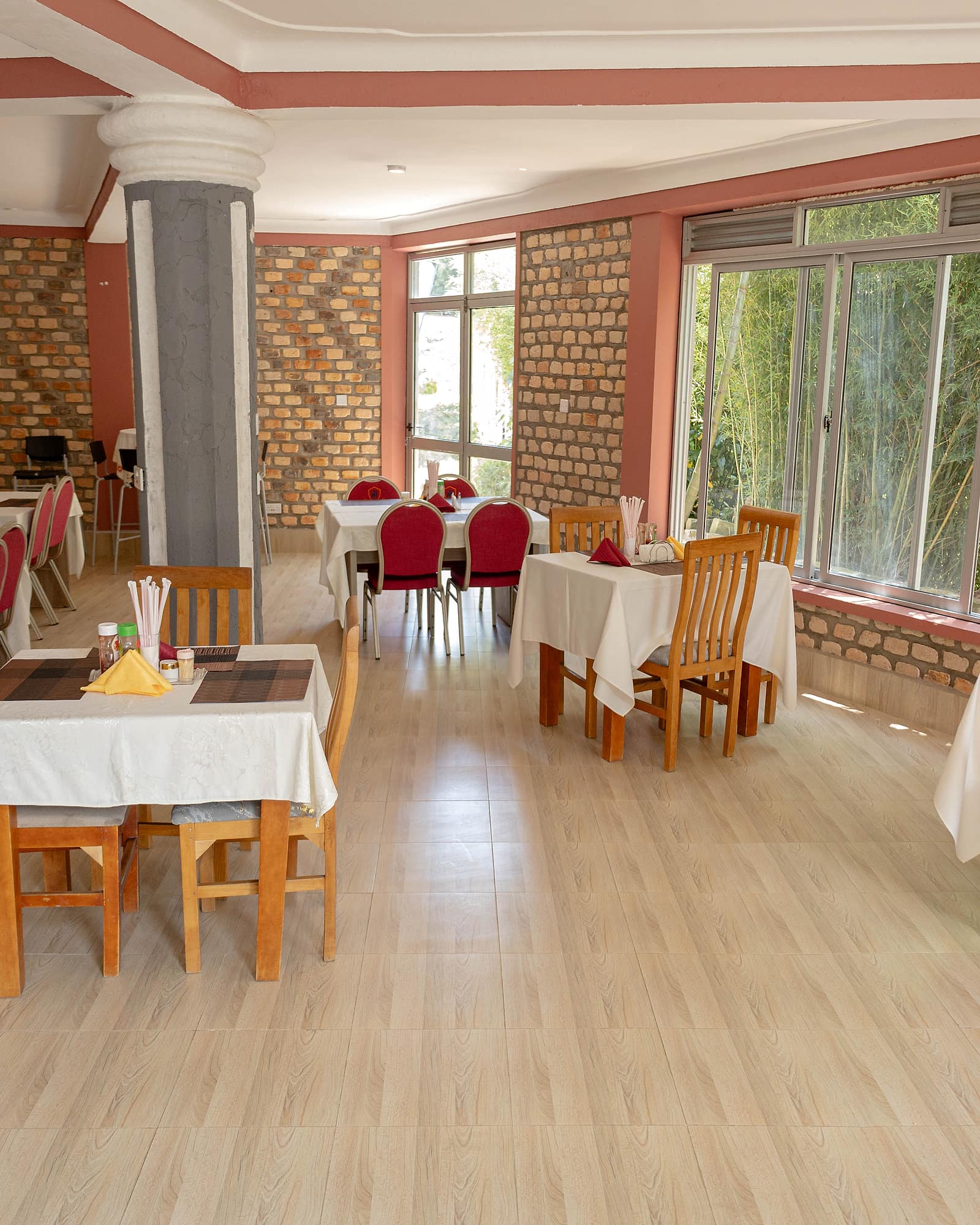 The dining room at Hotel Premier, built from local stone with the garden alongside