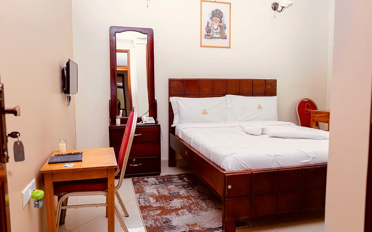 The single room, with the television and dressing table
