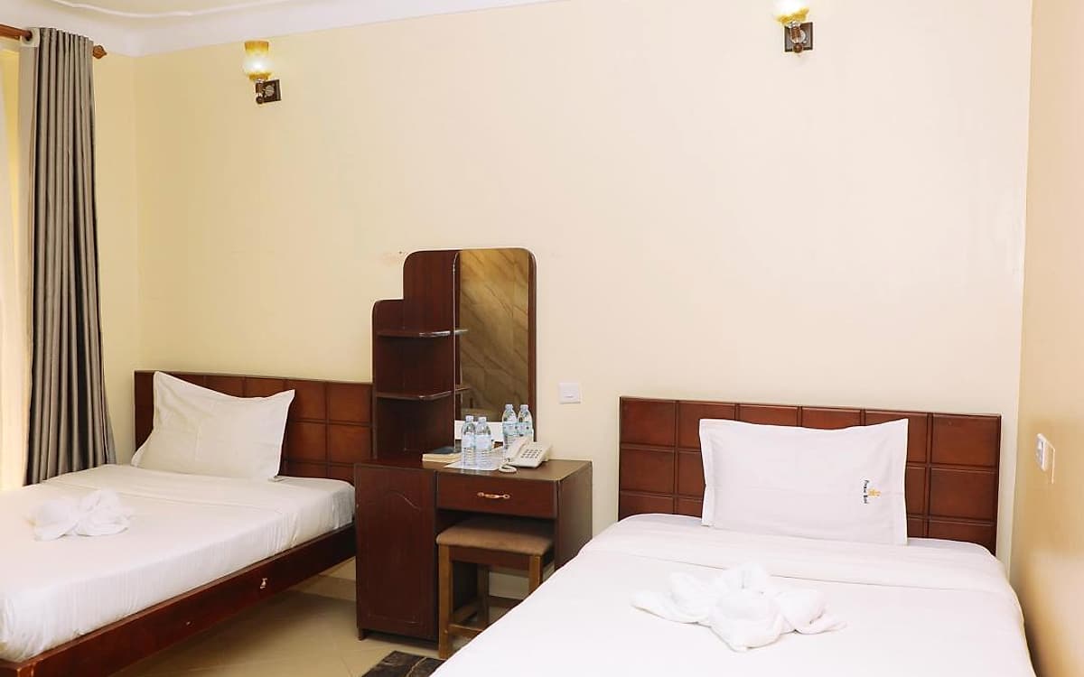 The twin room, looking across both beds to the dressing table